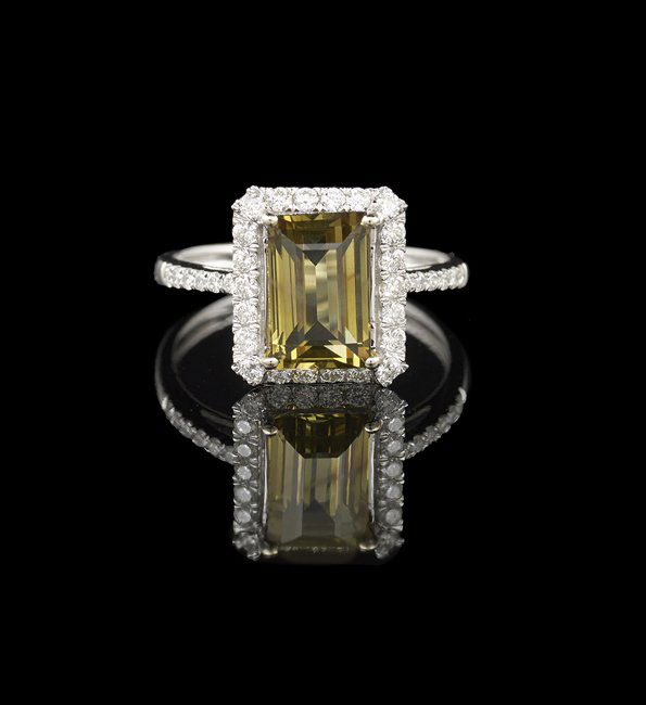 18 Kt. Gold, Alexandrite and Diamond Ring: Eighteen-Karat White Gold, Alexandrite and Diamond Ring, mounted with a central rectangular step-cut natural GIA certified alexandrite, with a weight of 2.74 carats, and with a color change from green