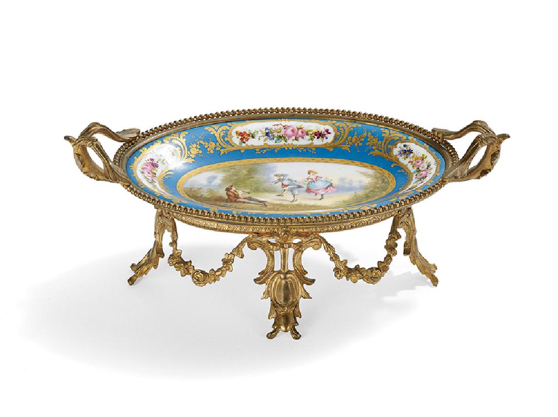 French Bronze and Porcelain Card Tray: French Bronze and Hand-Painted Porcelain Card Tray, fourth quarter 19th century, the tray painted on a Sevres blank and decorated with a panel depicting a trio in 18th-century costume, playing a pipe 