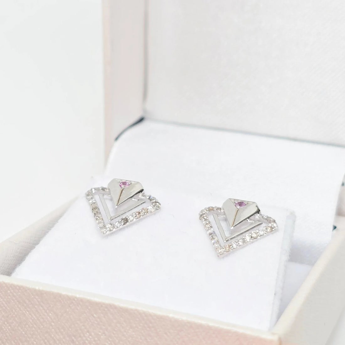 Celestial Triad 0.33ct Ruby & Diamond Triangular Stud Earrings in 14K White Gold: A rare triangular design featuring natural rubies framed by sparkling diamonds in 14K white gold. Elegant, unique, and handmade for timeless beauty. A distinctive and artistic expression of fine jewel