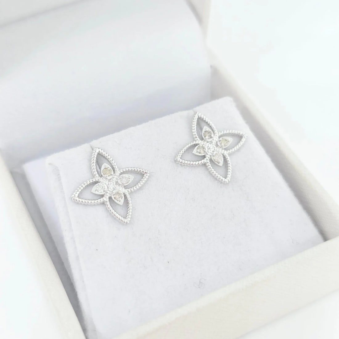 Sweetheart Celestial Sparkle 0.11ct Natural Diamond Earrings in 14K White Gold: A pair of dainty star-shaped diamond earrings handcrafted in solid 14K white gold â€” soft sparkle, everyday elegance, and natural beauty.These dainty twinkle star diamond earrings ar