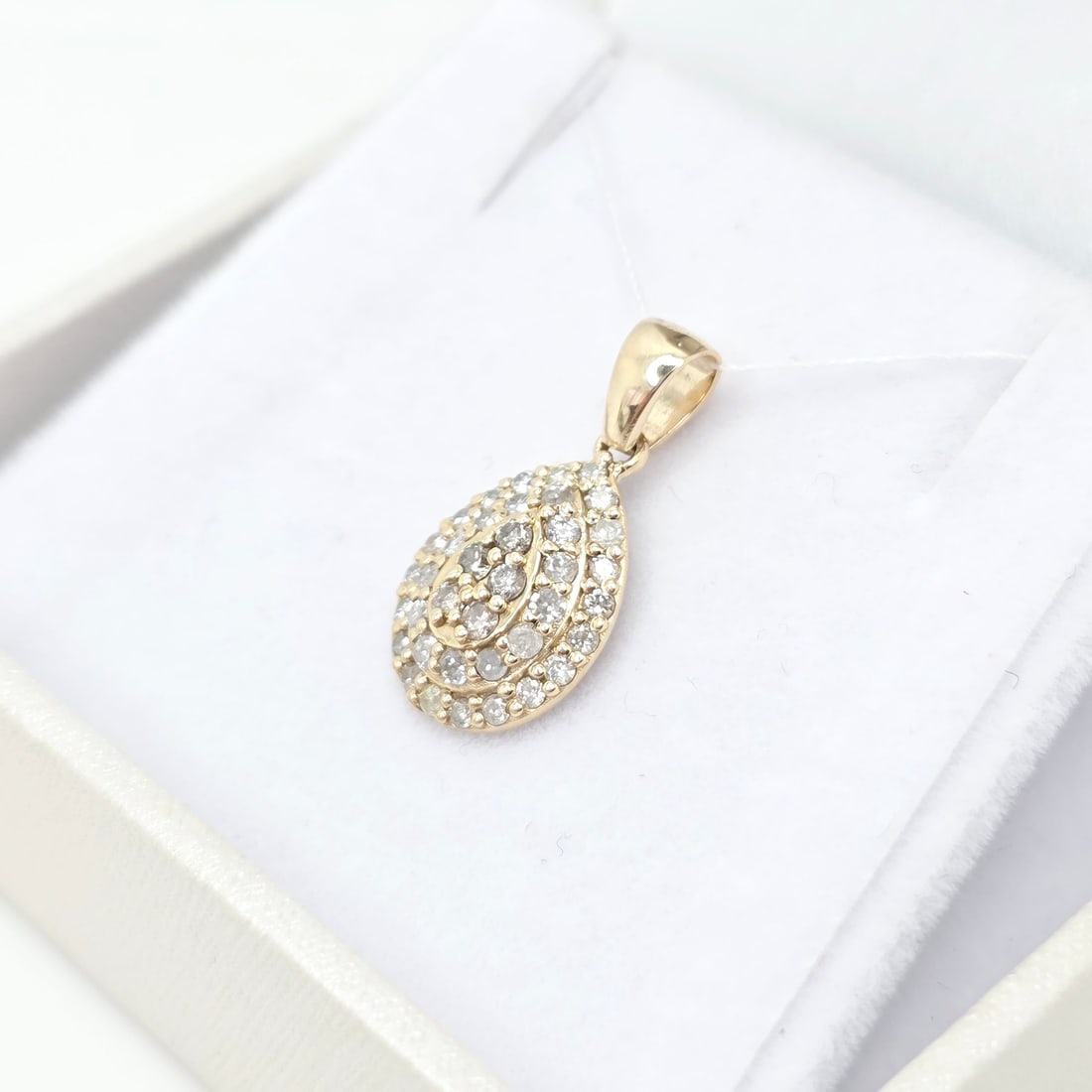 14K Yellow Gold Teardrop Diamond Pendant: Premium 14K Yellow Gold Teardrop Diamond PendantExquisite teardrop design symbolizing elegance and purity, warm yellow-gold hue enhances the brilliance and fire of each diamond 38 perfectly matched