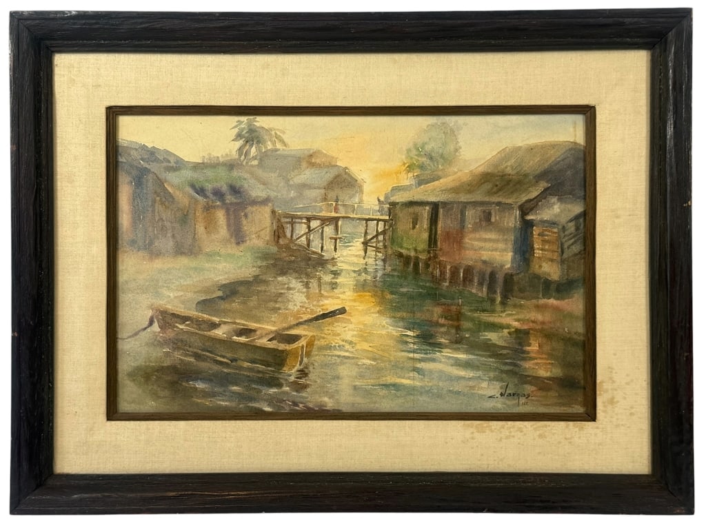 HARBOR SCENE WATERCOLOR ON BOARD SIGNED VARGAS: Mid century maritime watercolor painting on board depicting a tranquil waterfront village with stilt houses lining a narrow canal, a small rowboat resting in the foreground, and a wooden footbridge sp