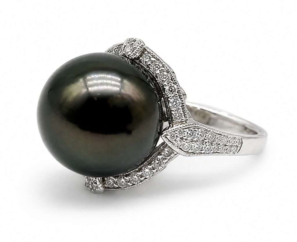 GGA PLATINUM SOUTH SEA TAHITIAN PEARL DIAMOND RING: Striking platinum ring centered with one GIA-certified cultured South Sea Tahitian pearl measuring approximately 14.35 x 14.22 mm (20.63 carats), displaying a dark gray body color with attractive orie