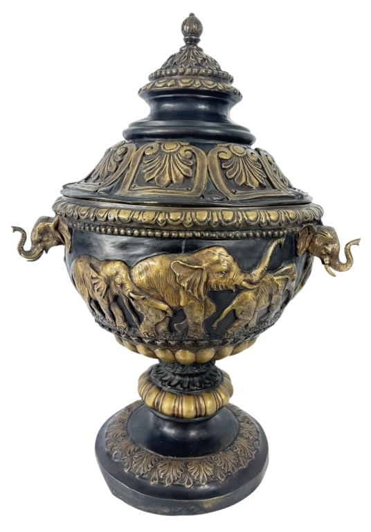 JIM DAVIDSON SIGNED LARGE BRONZE ELEPHANT URN/LID: Large and impressive signed Jim Davidson bronze covered urn featuring an elaborate elephant motif. The deep bowl-form body is decorated in high relief with a continuous procession of elephants, includ