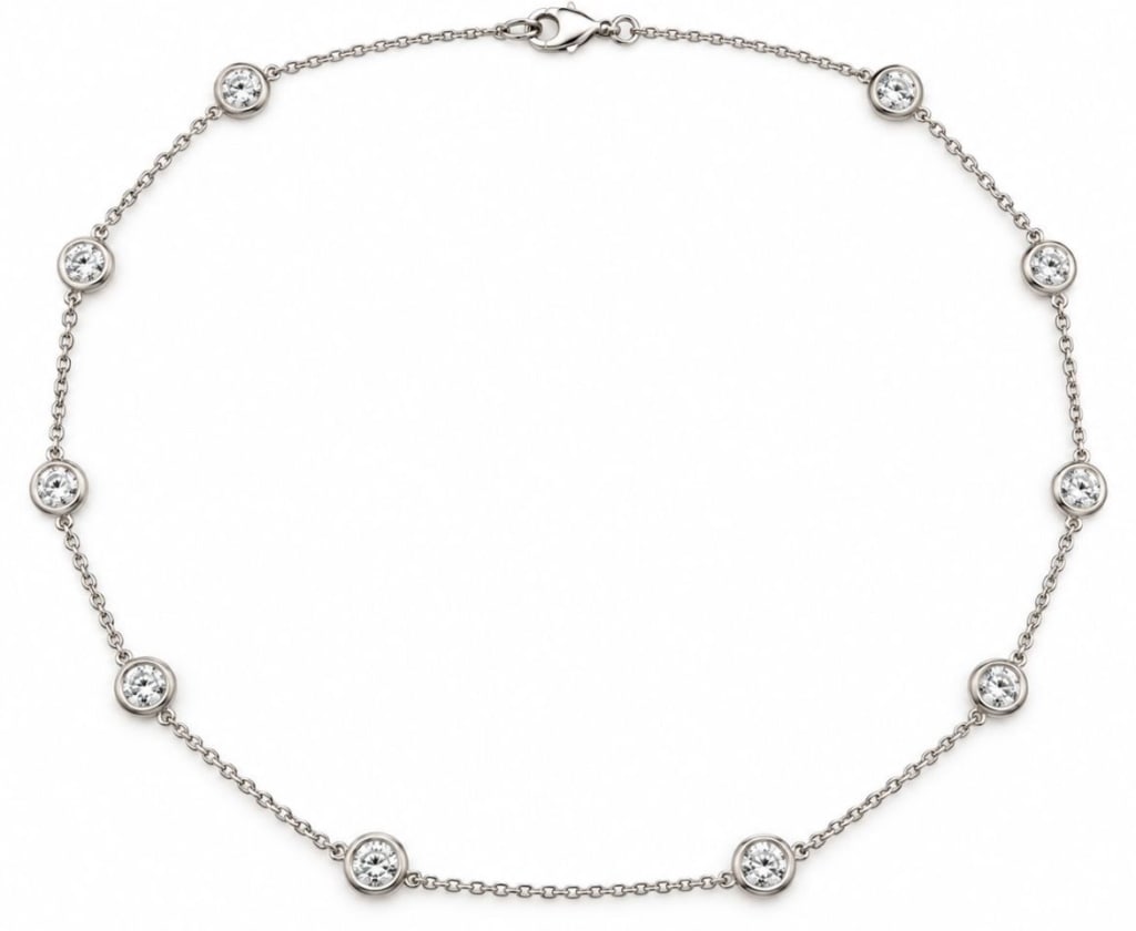 14K WHITE GOLD 2.45 CTW DIAMOND STATION NECKLACE: 14 karat white gold station necklace featuring 10 bezel-set natural round brilliant-cut diamonds weighing approximately 2.45 carats total. G-H color and SI1-SI2 clarity, with excellent cut, symmetry a