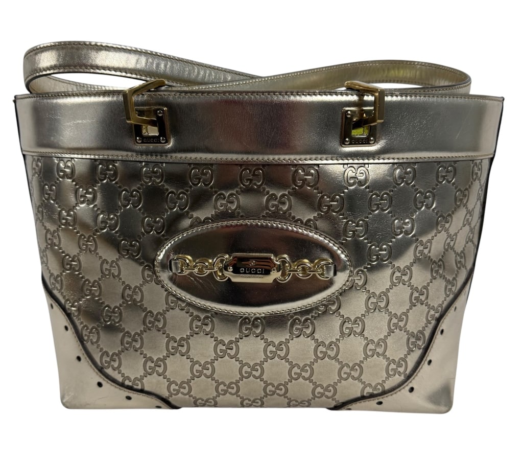 GUCCI METALLIC SILVER GUCCISSIMA LEATHER TOTE BAG: Authentic Gucci metallic silver leather tote/shoulder bag featuring the house's iconic Guccissima interlocking GG monogram embossed across the exterior. The structured design is accented with gold-ton