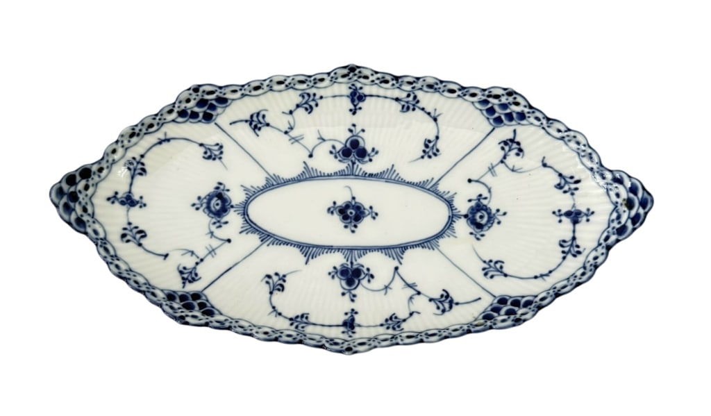 ROYAL COPENHAGEN BLUE FLUTED LACE DISH TRAY: Royal Copenhagen Blue Fluted Lace Dish Tray. The dish is marquise-shaped with a pointed oval form and a fluted exterior body. It features hand-painted underglaze blue floral and foliate motifs arrange
