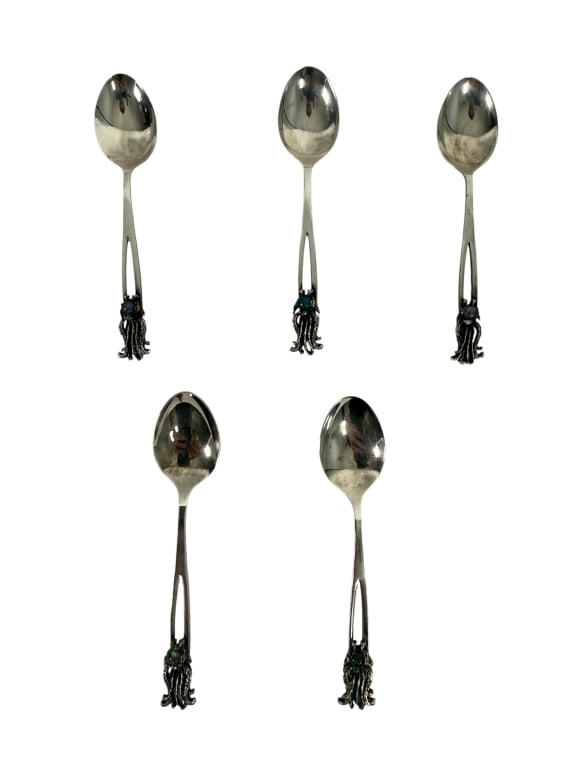 SET OF 5 STERLING SILVER CABOCHON SPOONS SIGNED: A set of five decorative sterling silver spoons featuring an elongated openwork handle terminating in an applied floral and foliate motif set with a blue-green cabochon. The distinctive handcrafted de