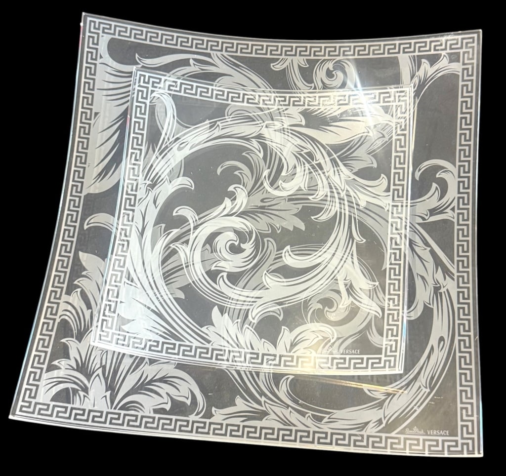 PAIR OF VERSACE ROSENTHAL ARABESQUE CRYSTAL BOWLS: Pair of Versace for Rosenthal Arabesque crystal bowls featuring gently curved square forms decorated with elaborate frosted Baroque acanthus scrollwork. Each is framed by Versace’s signature Greek k