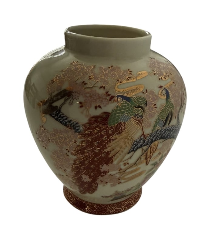 JAPANESE SATSUMA STYLE PORCELAIN PEACOCK VASE: This Japanese Satsuma-style ceramic vase features an ovoid body tapering to a short cylindrical neck and a small, slightly flared foot. The exterior is finished in a characteristic cream-colored crack