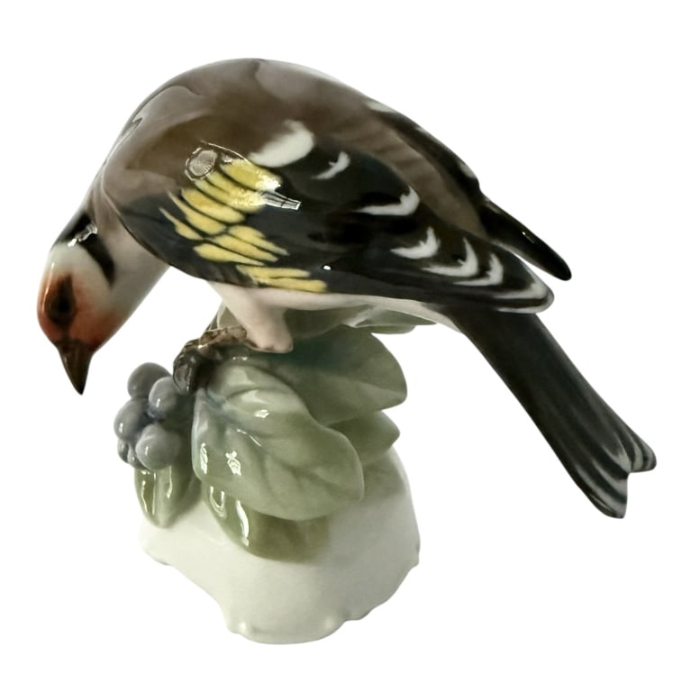 ROSENTHAL PORCELAIN GOLDFINCH BIRD FIGURINE: Vintage Rosenthal German porcelain bird figurine depicting a European Goldfinch perched upon a modeled leafy branch with berries. Finely modeled and hand-painted with naturalistic brown, black, white,
