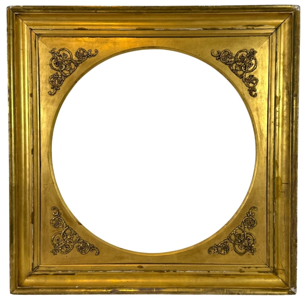 ANTIQUE GILTWOOD CIRCULAR PORTRAIT FRAME 38" x 38": Handcrafted antique gilt wood portrait frame featuring a distinctive circular opening within a square molded surround. Each spandrel is embellished with finely cast scrolling foliate and floral orname