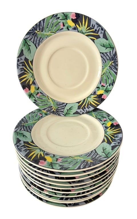 SET OF 11 VITROMASTER TROPICAL STONEWARE PLATES: Set of eleven Vitromaster “Key Largo” stoneware plates, circa 1990. Each with an ivory-colored center surrounded by a colorful tropical foliage border incorporating green and gray leaves w