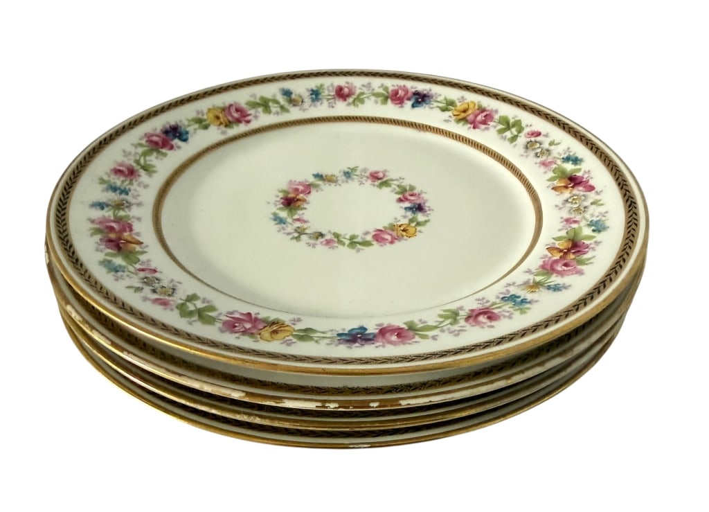 SET OF 4 LIMOGES FLORAL & GILT PORCELAIN PLATES: A set of four antique Wm. Guerin & Co. Limoges, France porcelain luncheon/salad plates, each decorated with a colorful floral garland featuring pink and yellow roses, blue blossoms and green foliage. 