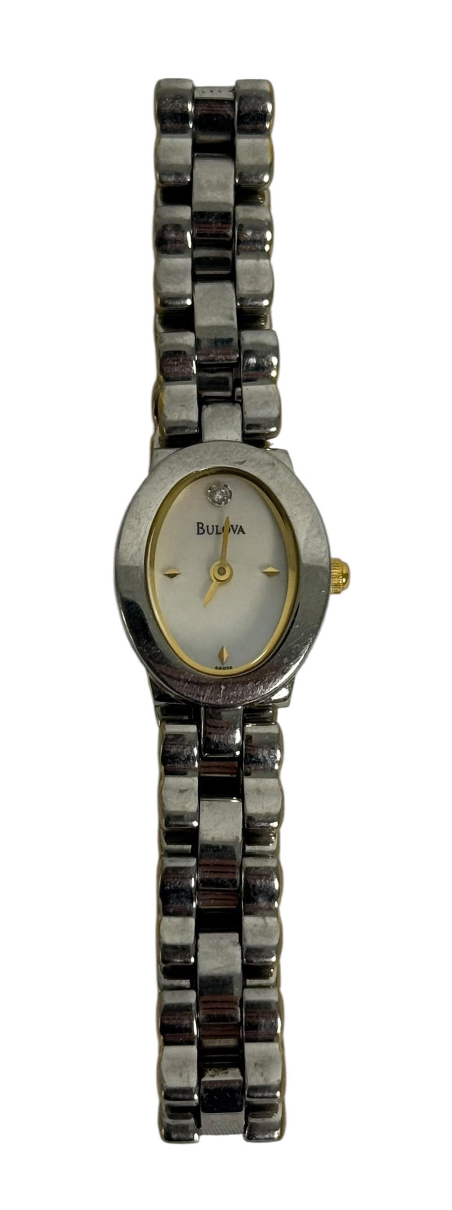 BULOVA LADIES MOTHER-OF-PEARL DIAL CRYSTAL ACCENT: Ladies’ Bulova wristwatch featuring a polished silver-tone oval case with gold-tone bezel, crown, hands, and applied hour markers. The pale mother-of-pearl-style dial is signed BULOVA and features a