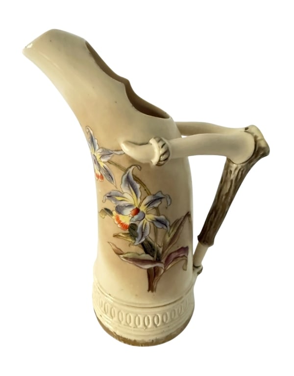 GERMAN PORCELAIN FLORAL EWER PITCHER CROWN R MARK: Vintage German porcelain decorative ewer featuring an unusual elongated spout, sculptural branch-form handle, and applied floral decoration. The cream-glazed body is embellished with colorful flowers 