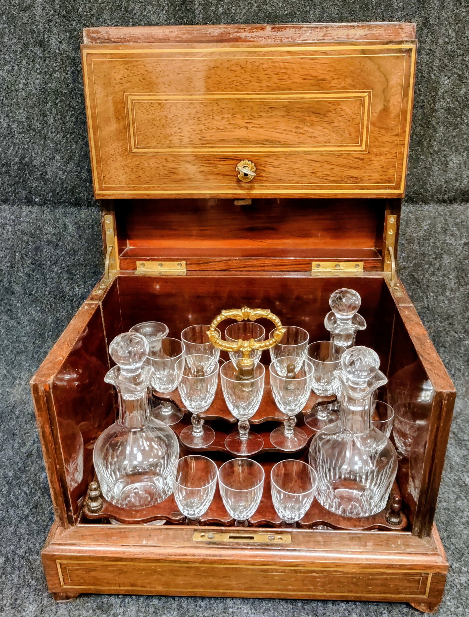 Cave à liqueur (Travel Bar): Cave à liqueur (travel bar) in Napolean III style, with four crystal flasks for liqueurs and 14 glasses, end of 19th century. Wood, Brass, Crystal, box 10" x 12.5" x 10"H with a key that locks the bo