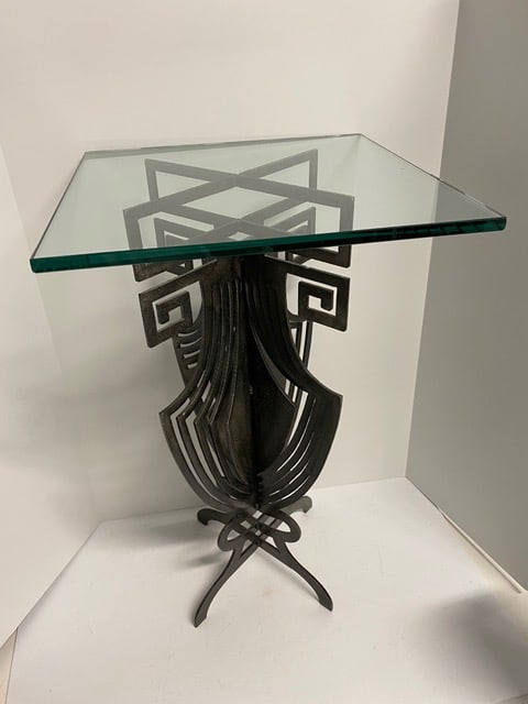 Sculptural 60's-70’s Cast Iron Stand: Sculptural 60's-70’s Cast Iron Stand has an Interesting design with beveled edge glass top. 25.5”H and15"square glass that is 1/2" thick