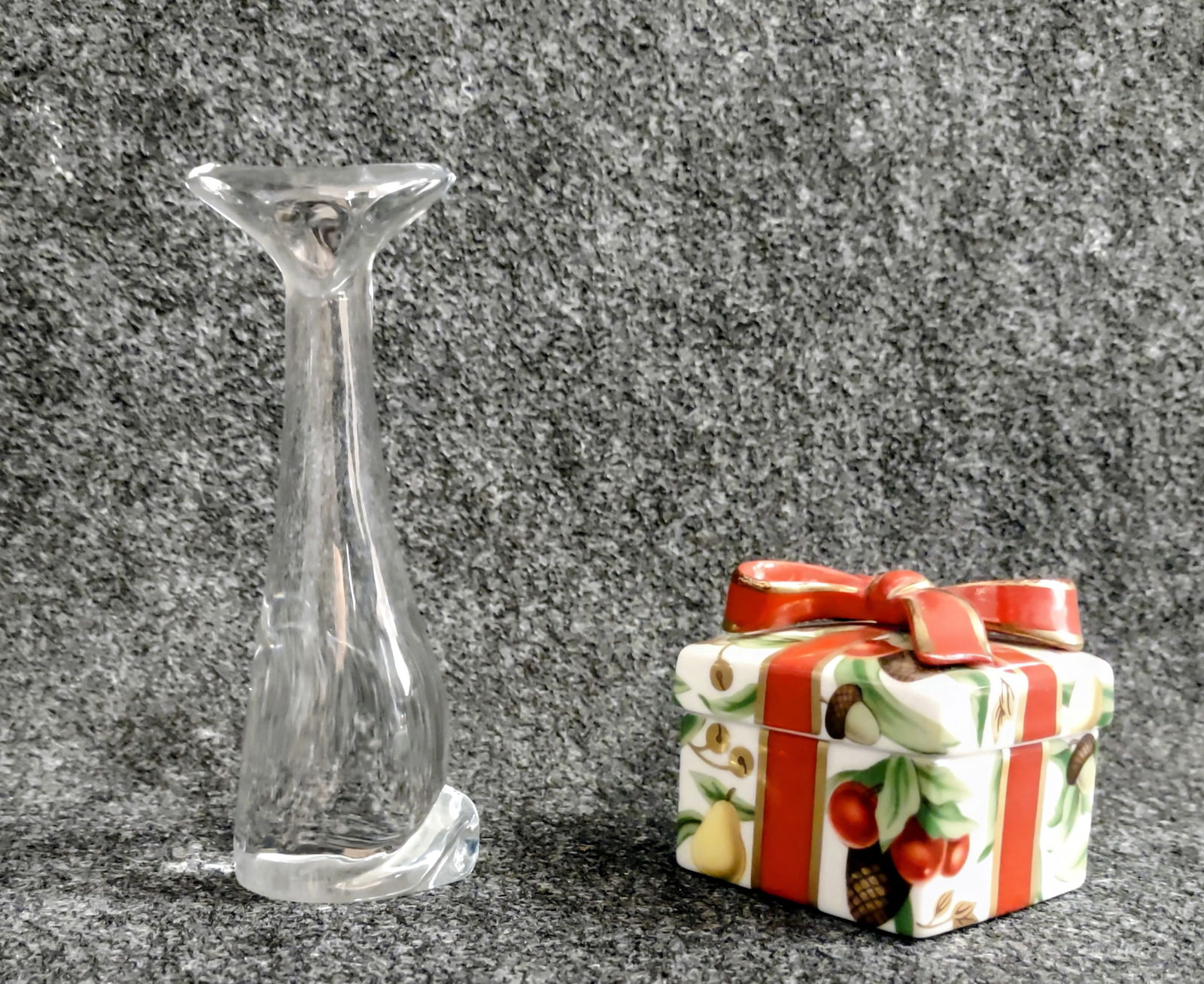 A Crystal Glass Cat by "Baccarat" and A holiday Trinket Box by "Tiffany": A Baccarat crystal Cat figurine sitting tall. The head is wide, the body is elongated, and the tail can be seen curled at the bottom of the piece. Measuring 4.75"tallA Tiffany & Co. Holiday Trinket Bo