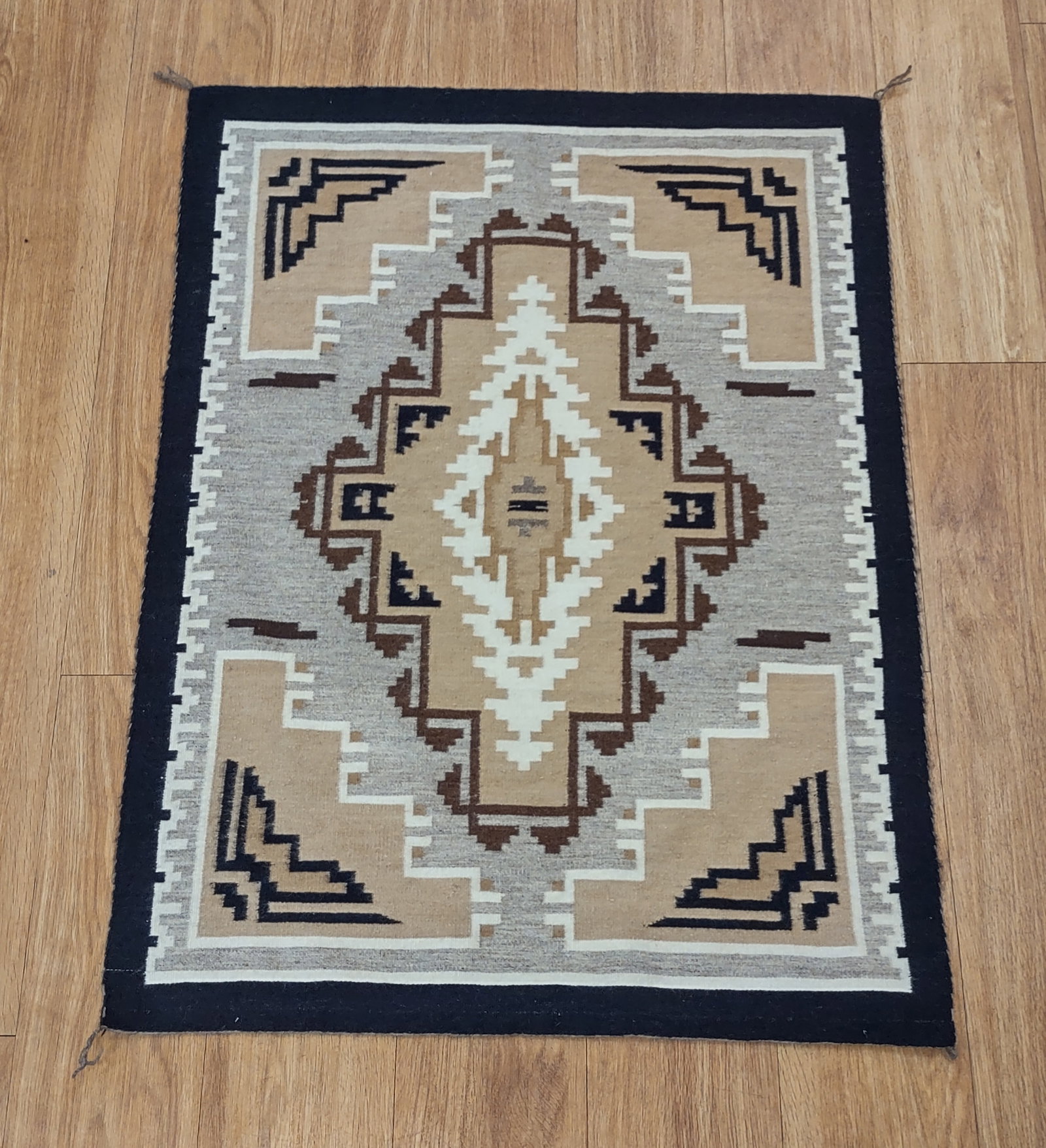 Antique Navajo Rug: Antique Woolen Navajo Rug measuring 27.5" x 36.5" in perfect condition.