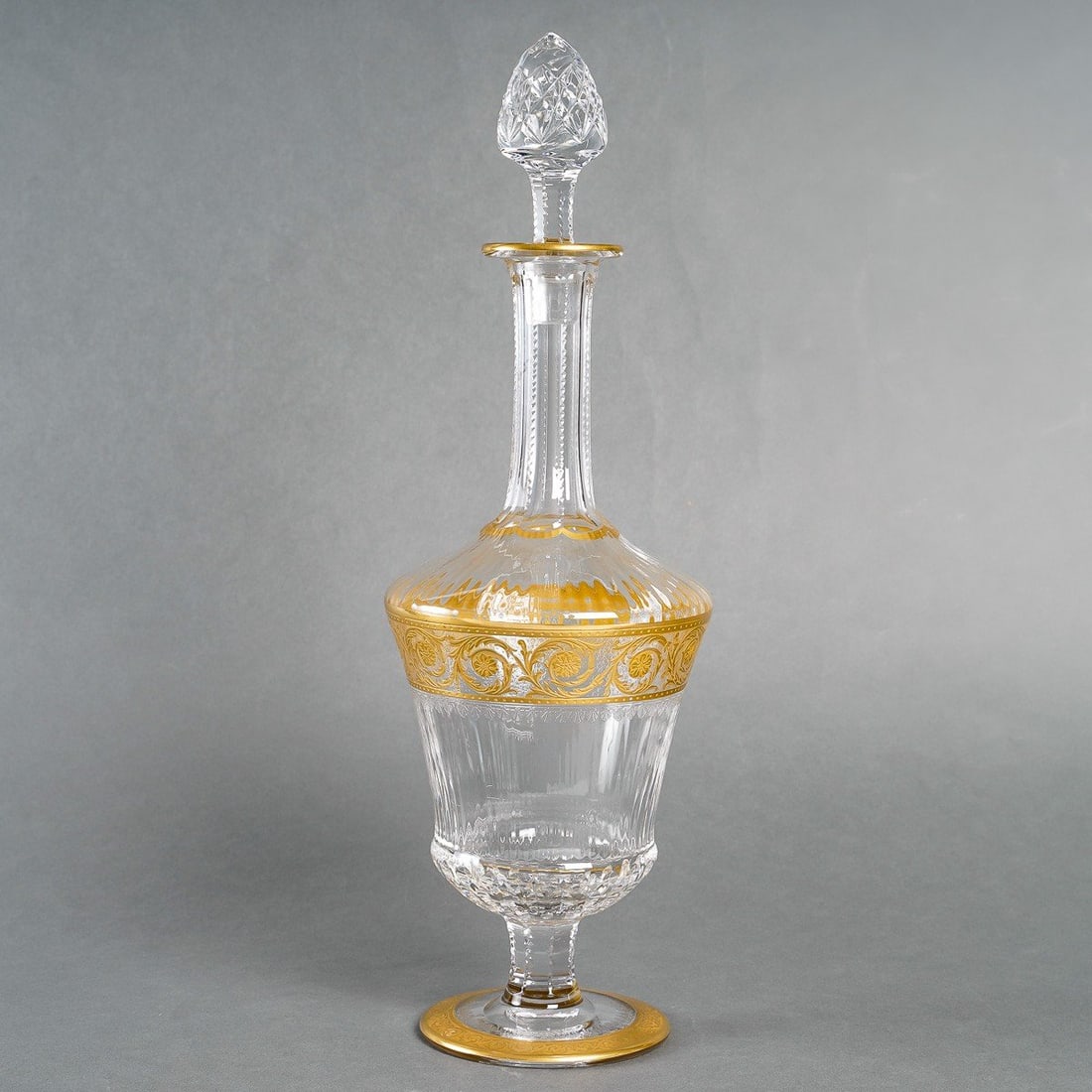Thistle Gold Wine Decanter by "Saint-Louis" France: Encrusted Gold Crystal Decanter Footed Cordial with Cut Crystal Stopper Measuring 10.5"H .Manufactured in France and stamped at the bottom.