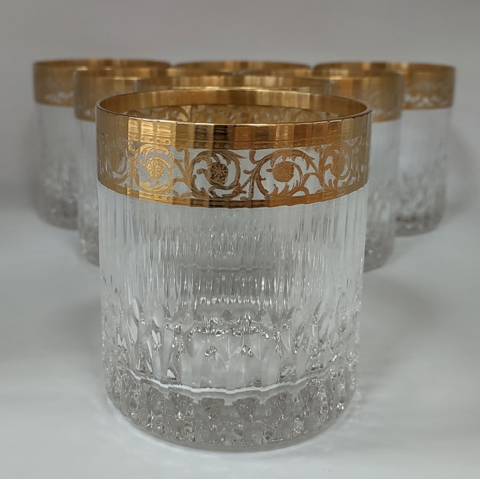 Thistle Gold Seven (7) Large Cylindrical Tumbler By "Saint-Louis" France: Seven (7) Large Cylindrical Tumbler 3.5" Inches Tall. Etched Mark St Louis Very Good Condition. .Manufactured in France and stamped at the bottom.