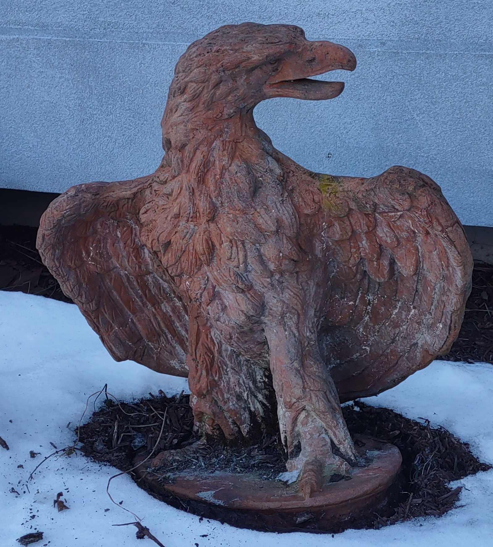 An Antique Life Size Terra Cotta Eagle: An Antique Life Size of Finley Cast Terracotta Eagle, with it's wings partially upswept. Please see all photos for it's condition. It's weathered and has a lovely patina.