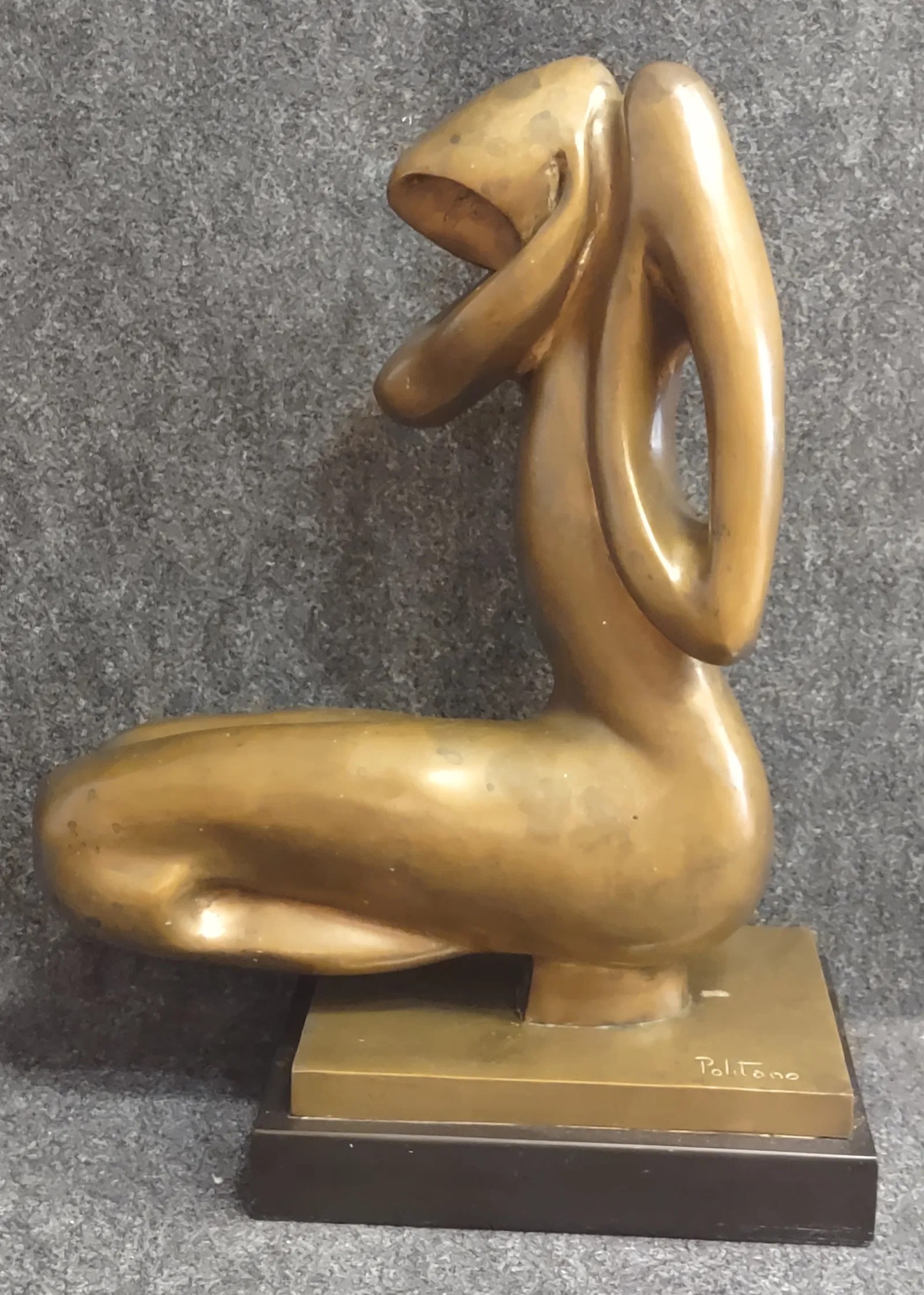 Sculpture By " Waldimiro Politano" (Born 1940): An Amazing work of art by the famous Italian Sculptor " Waldimiro Politano" (Born 1940). Beautifully scalpted of a woman in a sitting position on a thick black marble. Signed Politano. Solid Bronze wi