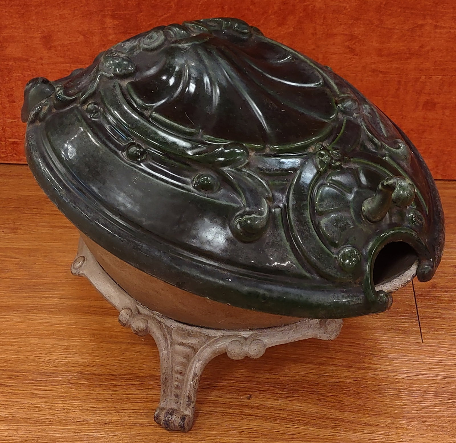 Antique Art Nouveau Cast Iron Clamshell Coal Scuttle: Antique cast iron coal scuttle featuring an unusual clamshell-form design with a green enamel-painted lid highlighting the ornate cast details. Early gate mark visible on the cast iron base. Measures 