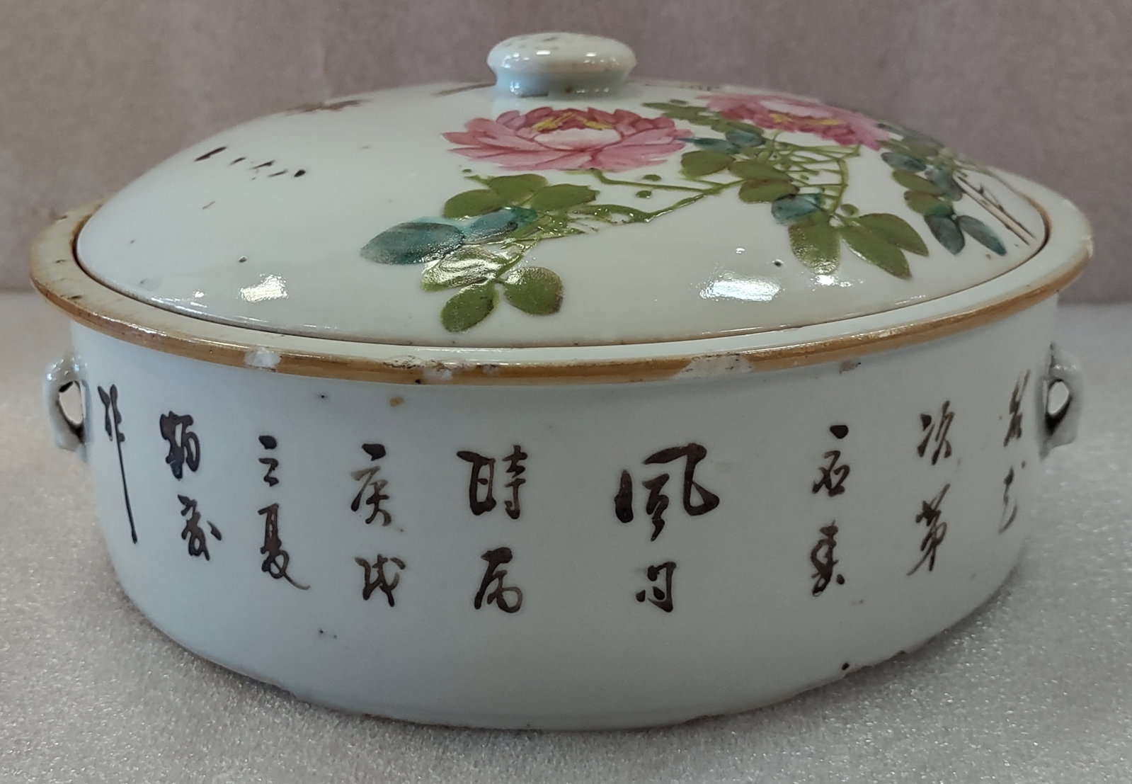 Chinese Domestic Porcelain Covered Rice Dish 19th C.: Chinese 19th century covered rice dish in two parts, featuring a knob handle to the lid and side lift forms originally designed for a heavy wire handle used to carry the hot vessel. A fine example of