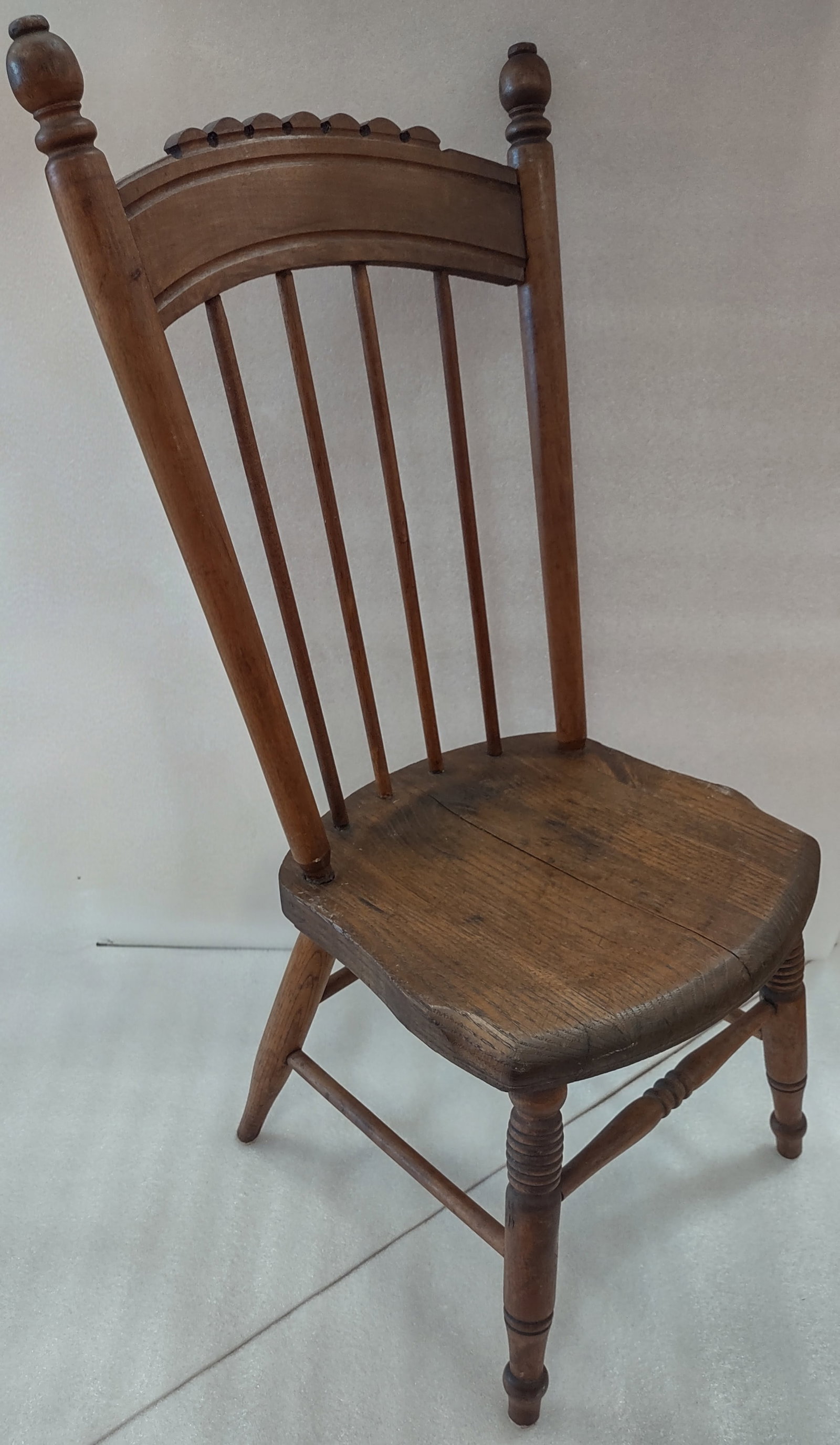Antique Oak Child's Chair: Antique Americana oak child’s chair, well-preserved with a sturdy, structurally sound frame. Classic early American form with simple, functional design and warm oak finish. Measures approximately