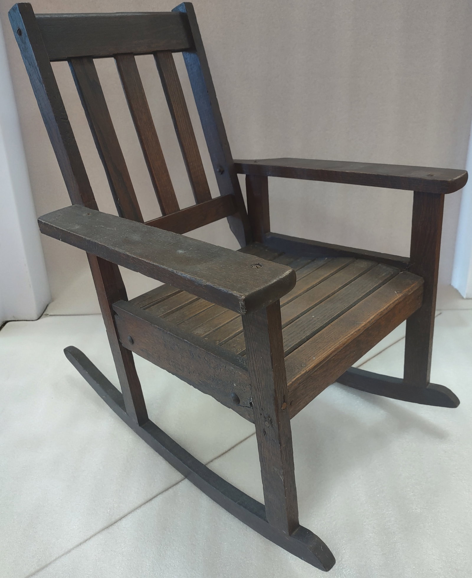 Mission Oak Child's Rocking Chair Sticklley Style: Mission oak child’s rocking chair in the Stickley style, early 20th century, featuring a classic three-slat back and sturdy Arts & Crafts construction. Solid oak with clean lines and traditional