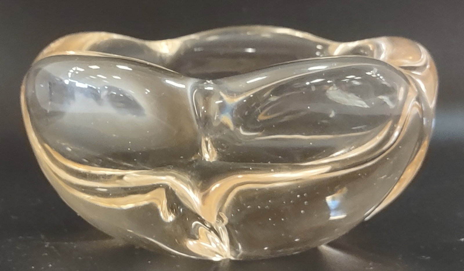 Daum France Signed Crystal Flower Bowl: Signed crystal flower bowl by Daum, France. Sculptural floral-inspired design in finely crafted crystal with elegant form and refined clarity. Measures approximately 2 inches high by 3.75 inches