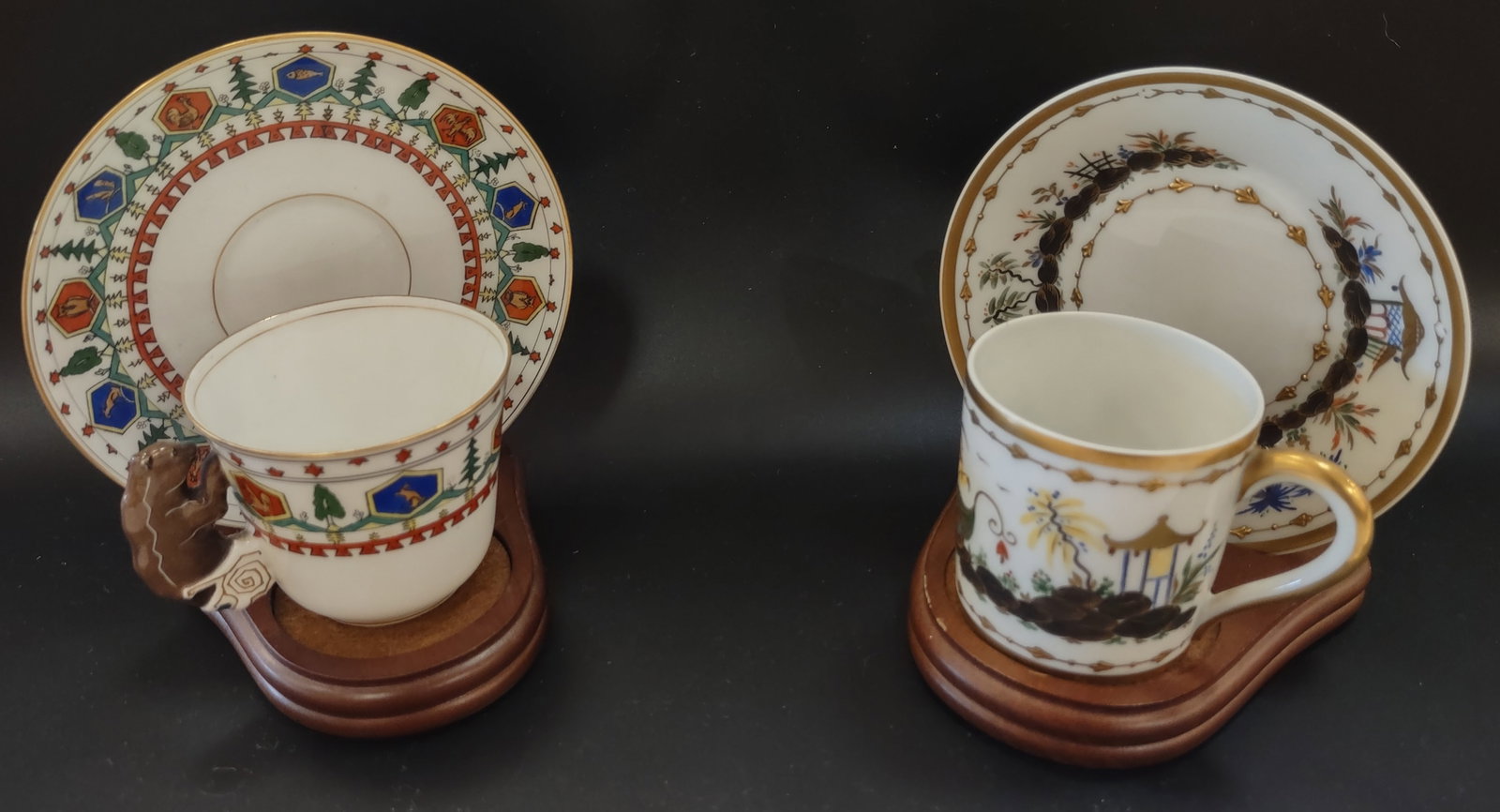Antique Teacups with Saucers Russian and French: Pair of elegant antique tea cups with matching saucers, featuring two distinct examples of fine porcelain craftsmanship.One set is Russian made by the renowned Kornilow Brothers, known for