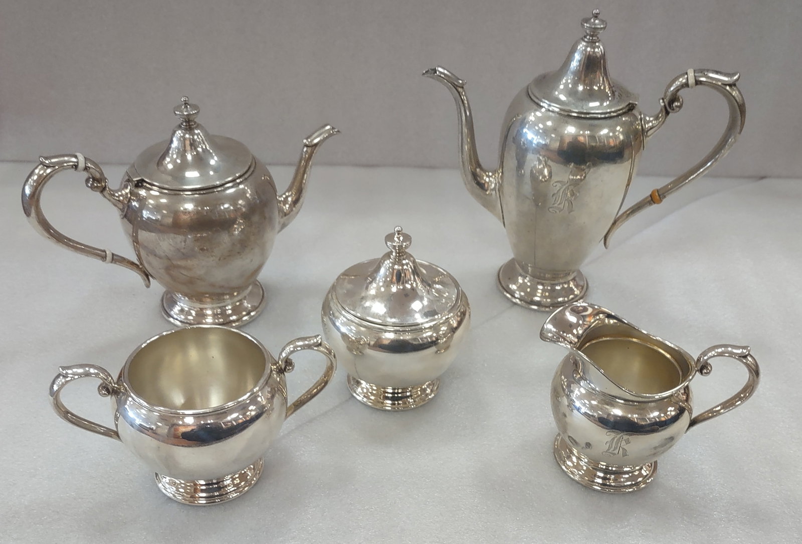 Exquisite Sterling Silver Tea set by Gorham 1of 2: Exquiste Sterling Silver Tea Set by Gorham, Monogrammed K. Total Silver weight 58.32 ozt. Shipping: Multiple shipping options available. In-house shipping or local pickup is recommended; buyers are