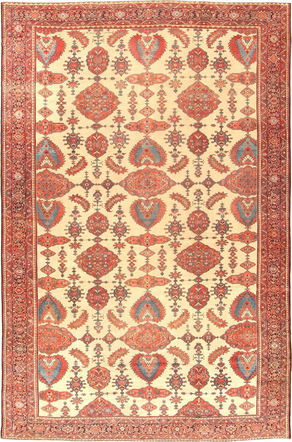 Antique Sarouk-Farahan Persia, Late 19th century: The overall array of small medallions, serrated leaves and elongated cartouches unfolds in orderly repetition across the open ivory ground on this elegant antique Sarouk-Farahan. Smaller ornaments enl