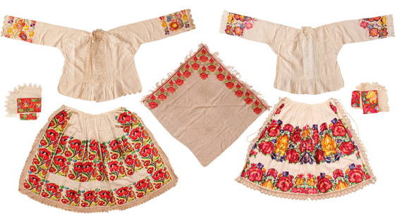 A Group of Seven Guatemalan Embroidered Garments, Including 2 Blouses, 2 Aprons, a Scarf and 2 Caps: A Group of Seven Guatemalan Embroidered Garments, Including Two Blouses, Two Aprons, a Scarf and Two Caps Early 20th Century. Skirt Blouse with Embroidered Cuffs Blouse with Embroidered Cuffs Lace