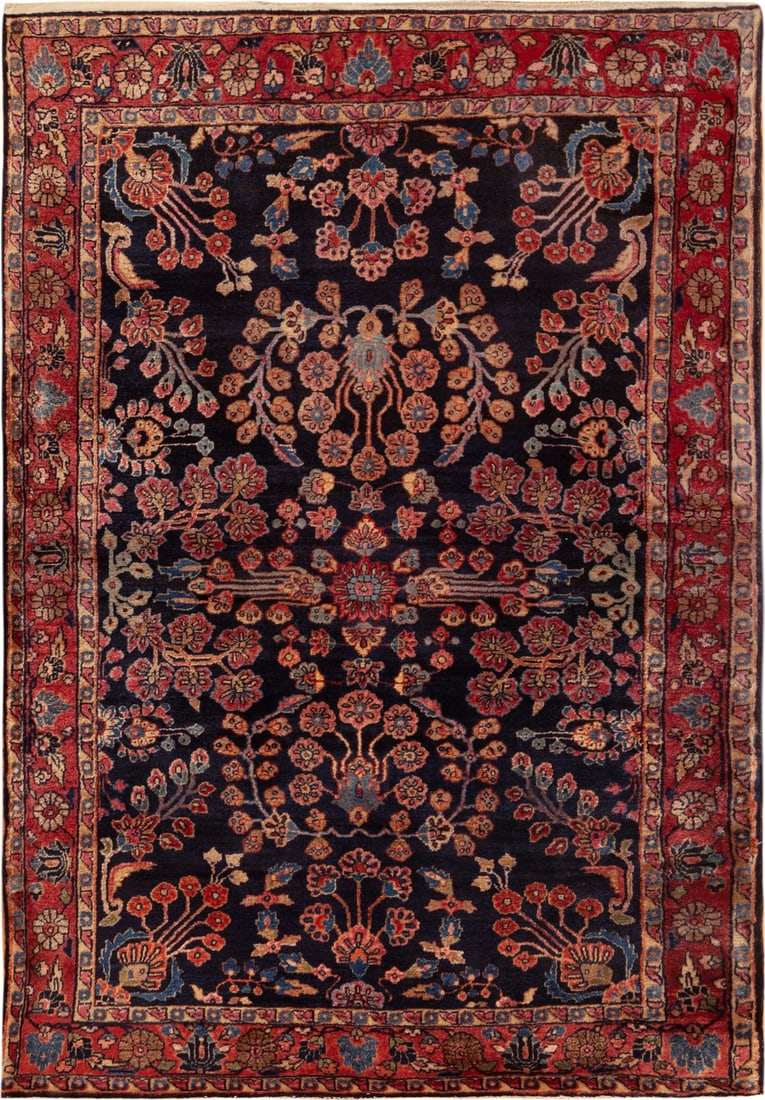 Antique Persian Sarouk Mohajeran Rug 4 ft 10 in x 3 ft 4 in (1.47 m x 1.01 m): Curated collection of antique, vintage and modern rugs Size: 4 ft 10 in x 3 ft 4 in (1.47 m x 1.01 m) Provenance: Collection of a late German collector Aghajan Nassimi Against a dark navy field, the f