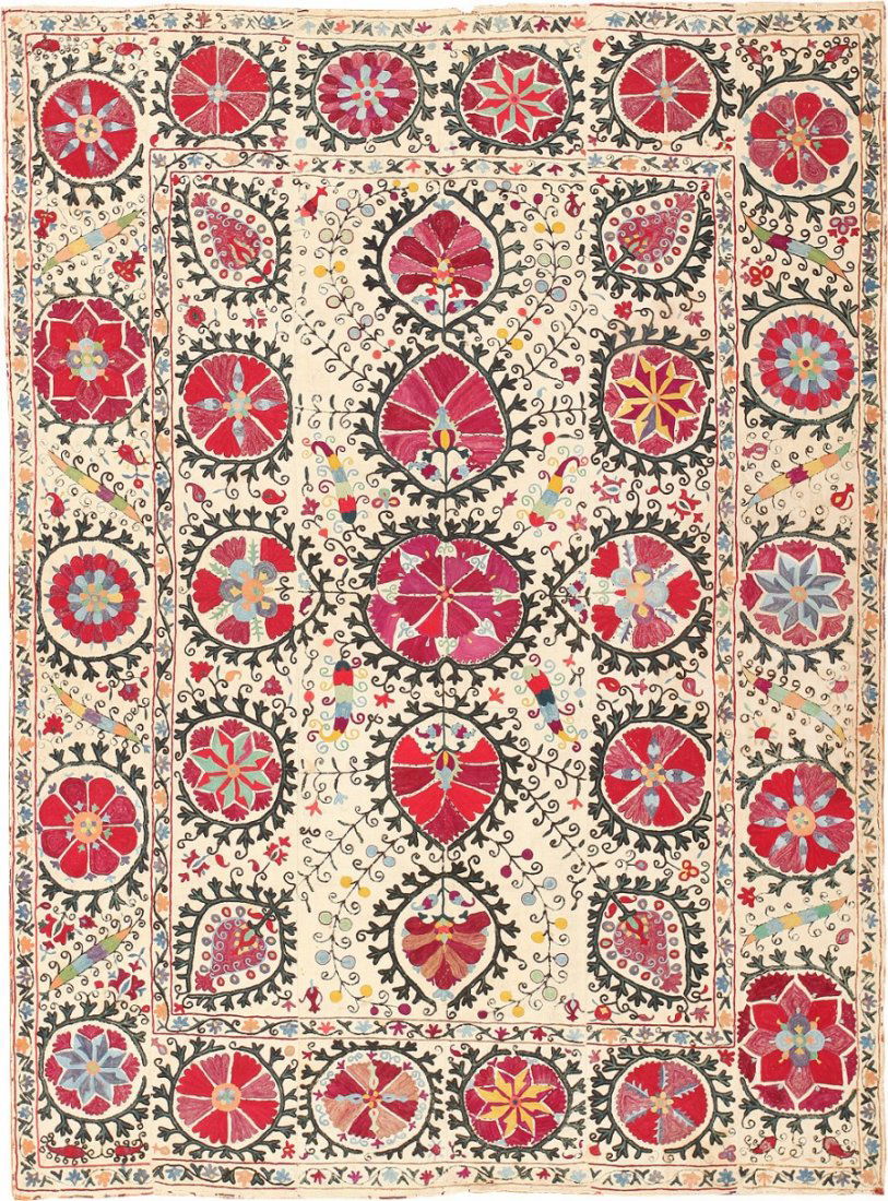 Collectible Antique Uzbek Suzani Embroidery Textile: Size: 5 ft 6 in x 7 ft 6 in (1.68 m x 2.29 m) - Circa 1880 - This magnificent antique Uzbek suzani is a colorful work of art with lavish embroidered decorations and ample ethnographic charm ideal for