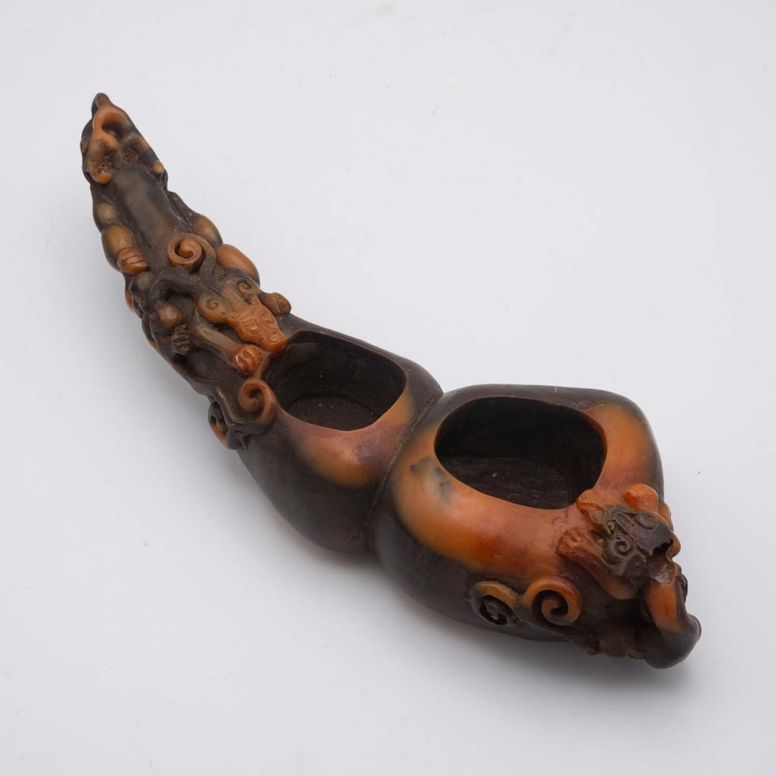 A Fine Antique Chinese Intricate Carved Horn Shaped Mythical Beast Ink Well: Medium: Horn ShapedSize: 9x3.3x1.7 inchesAge/Detail: A Fine Antique Chinese Intricate CarvedCondition: great overall, check photo for condition reference.Provenance:Collection from Estate in TribeccaL