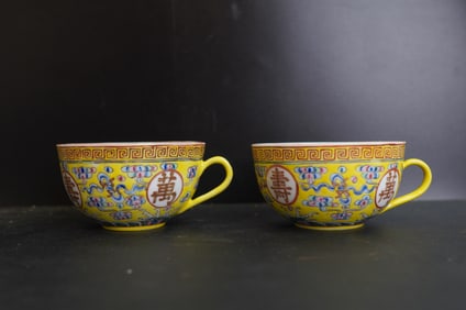 A Pair Of Chinese Yellow-ground Famille Rose Cups, Guangxu Period