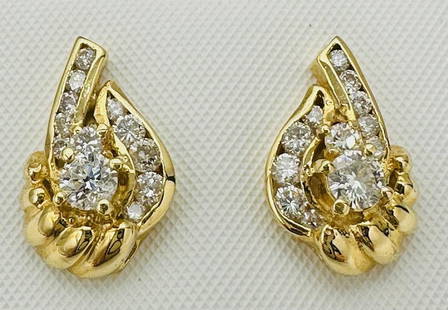 14KT Yellow Gold Pair of Natural Diamond Earrings # 2072: # 2072 14KT Yellow Gold Pair of Natural Diamond Earrings 24 Pieces Diamond 0.80 carat(t.w.) Earrings Weight: 3.20 grams Push backs Earrings size: 14.5 mm x 9.50 mm