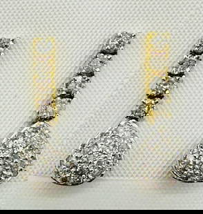 18KT White and Yellow Gold Pair of Natural Diamond teardrops Earrings # 2076: # 2076 18KT White and Yellow Gold Pair of Natural Diamond teardrops Earrings 44 Pieces Diamond 0.85 carat(t.w.) Earrings Weight: 4.00 grams Push backs Earrings size: 21 mm x 13.80 mm