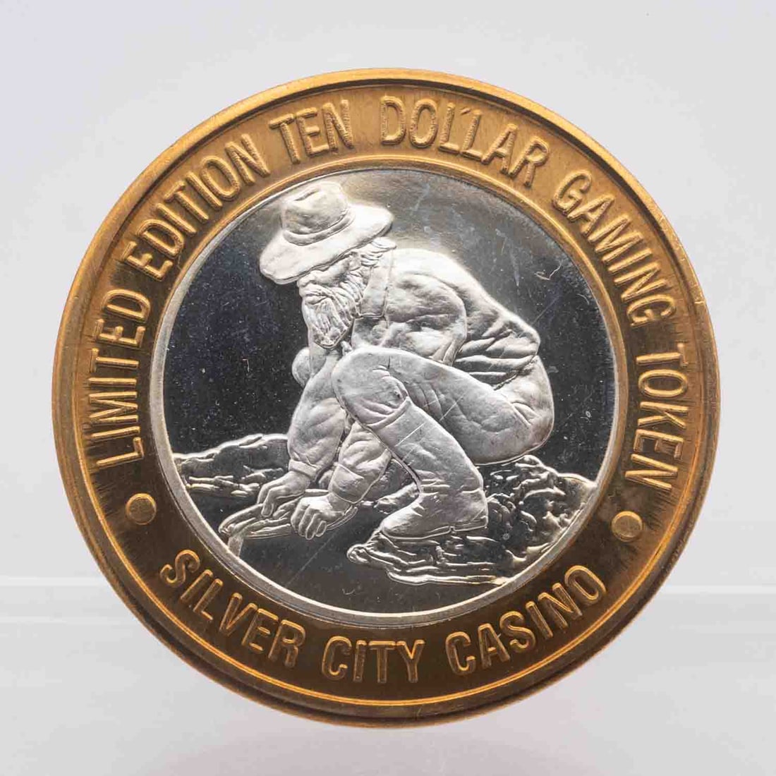 Silver City Casino 999 Silver Collector's Series Gaming Token: MLC01139 Subject: Silver City Casino 999 Silver Collector's Series Gaming Token Medium: Approximate weight of 0.60 oz of 999 Silver With Brass Ring Year: Condition: MS Note: Any condition statement is
