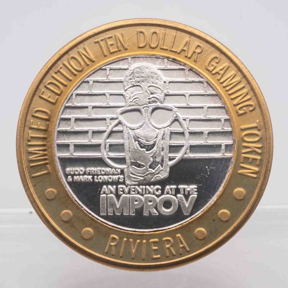 Riviera Improv 999 Silver Collector's Series Gaming Token: MLC01141Subject: Riviera Improv 999 Silver Collector's Series Gaming TokenMedium: Approximate weight of 0.60 oz of 999 Silver With Brass RingYear: Condition: MSNote: Any condition statement is given a