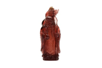 A CHINESE AMBER COLOURED GLASS 'SHOU LAO' SNUFF BOTTLE
