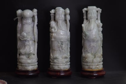 A GROUP OF THREE CHINESE JADE 'GUARDIAN' FIGURES