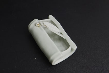 A CHINESE DOUQIN CELADON BRUSH REST, REPUBLIC PERIOD