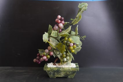 A Chinese 20th century jade and semi-precious stone vine in a pot