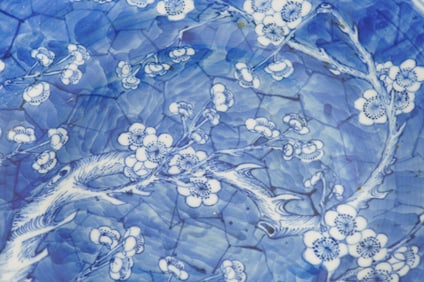A FINE CHINESE BLUE AND WHITE PINE TREE AND PLUM DISH, 17TH CENTURY